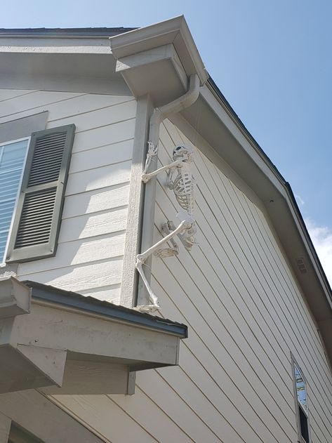 Skeleton On Roof Halloween, Attach Skeletons To House, Skeleton Hanging From House, Skeleton On House Halloween, Hanging Skeletons On House, Skeletons On House Halloween, How To Attach Skeletons To House, How To Hang Skeletons On House, Skeletons On Roof