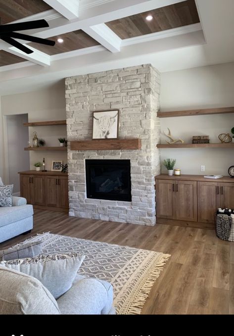 Off White Wall Living Room, Living Room Built Ins With Open Shelves, Open Light Living Room, Bedroom Fireplace Sitting Area, Stone Wrapped Fireplace, Stone Built In Fireplace, Mixed Rugs In Open Floor Plan, Rustic Fireplaces With Built Ins, Fireplace With Floating Shelves On Sides Wood