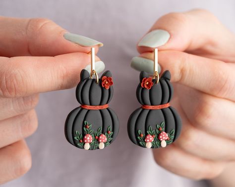 The earrings are made from polymer clay. If you are looking for different and stylish earrings, here you are. I dreamed of them. These earrings are not available anywhere else. I used 24 k gold plated material. they will never irritate your ears. You must be excited to wear these stylish and designer earrings. because it will probably be just you. Halloween clay earrings | |halloween jewelry |black cat  earrings |spooky earrings |handmade earrings Material : 24K gold plated bar post ,polymer cla Black Cat Polymer Clay Earrings, Hocus Pocus Polymer Clay Earrings, Earrings Handmade Polymer Clay, Fall Earrings Clay, Halloween Polymer Clay Earrings, Halloween Earrings Polymer Clay, Halloween Clay Earrings, Cat Polymer Clay, Fimo Halloween