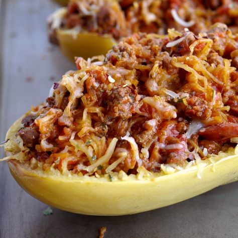 All the flavors of a hearty spaghetti dinner packed into a tender, roasted spaghetti squash. This Stuffed Spicy Italian Spaghetti Squash Boats recipe are the answer to comfort food made in a healthy way.  A fork is all it takes to separate the pale orange strands of the gourd into vegetable noodles. It couldn't be easier to make. Italian Spaghetti Squash, Spaghetti Squash Boats, Easy Spaghetti Squash, Spaghetti Squash Boat, Roasted Spaghetti Squash, Squash Boats, Vegetable Spaghetti, Italian Spaghetti, Stuffed Squash