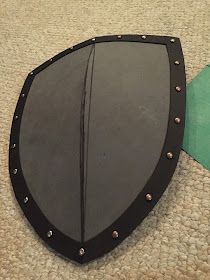 Diy Knight Costume, Medieval Costume Diy, Large Puzzle Pieces, Knight Shield, Medieval Shields, Kids Homemade, Knight Costume, Foam Flooring, Steel Paint