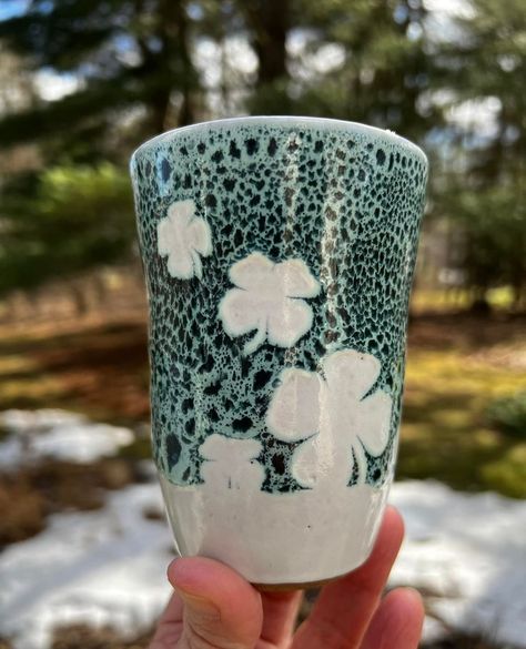 this tumbler was glazed with three coats of Amaco Rainforest applied on the exterior over vinyl shamrock stickers and down to within 1-1/2” from the bottom. Once the glaze had dried, the stickers were peeled off exposing the bare bisque ware. Then three coats of Amaco Snow was brushed on the entire exterior and interior. The clay is Laguna #75 fired to cone 5. ☘️ 💚🍀 Amaco Rainforest, Rainforest Glaze, Amaco Snow, Amanda Wilson, Pottery Glaze Ideas, Clay Bodies, Glazing Ideas, Amaco Glazes, Glaze Combinations