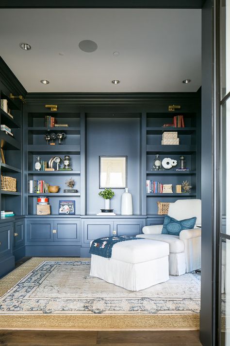 Navy Blue Den with Built-in Shelves and Cozy Chair and Ottoman Blue Shelves Bookshelves, Navy Blue Reading Nook, Navy Blue Shelves, Navy Built In Bookcases, Navy Snug Room, Blue Bookshelves Living Room, Navy Blue Library Room, Navy Blue Den, Navy Blue Bookshelves