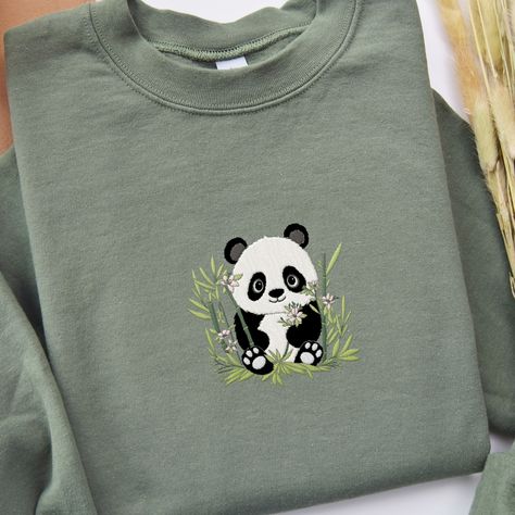 𝑬𝒎𝒃𝒓𝒐𝒊𝒅𝒆𝒓𝒆𝒅 𝑷𝒂𝒏𝒅𝒂 𝒔𝒘𝒆𝒂𝒕𝒔𝒉𝒊𝒓𝒕 🐼 🐼 This adorable and whimsical panda Sweatshirt is a great addition to your all season wardrobe, especially in spring! 🌼 It's prefect for taking a walk, running errands, chilling at home, or hanging out with friends! Our crewnecks are made from the highest quality fabric for an incredibly soft and comfortable fit. You can find the sweater in my Etsy Shop 🤍 👉🏻 link in Bio #embroiderydesigns #embroideredart #embroidery #sweatshirtforwomen #embroidered #embroider... Panda Sweater, Chilling At Home, Hanging Out With Friends, Panda Shirt, Kawaii Panda, Out With Friends, Taking A Walk, Embroidered Art, Embroidered Clothes