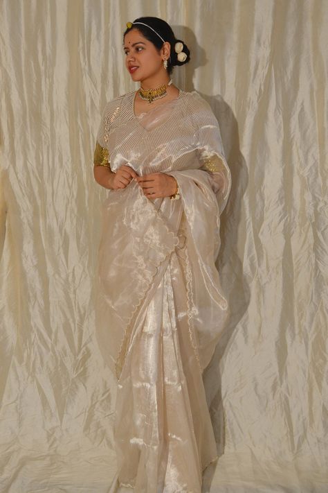 White metallic saree in tissue base with scallope border detailing. Component: 1 Fabric: Tissue Color: White Other Details:  Note: The blouse worn by the model is not for sale Occasion: Puja - Aza Fashions White Tissue Saree, Metallic Saree, Saree White, Tissue Saree, Border Saree, Saree For Women, Saree Border, Indian Outfit, Malang