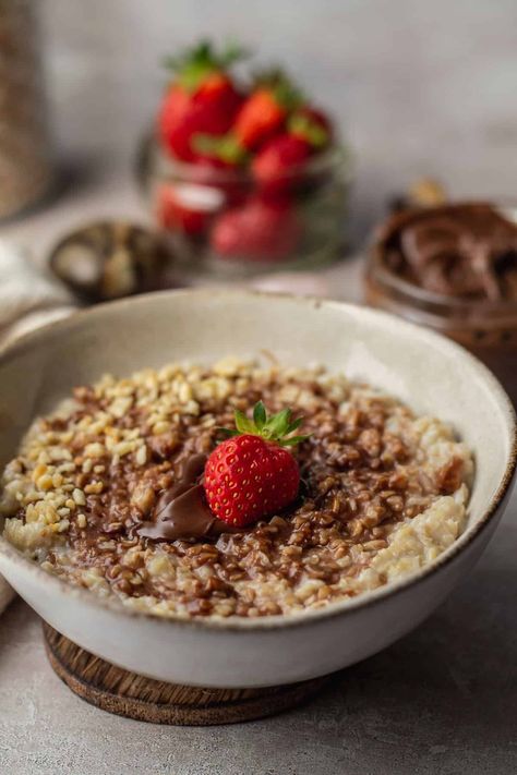 Nutella Oatmeal is a quick and hearty breakfast with a hint of sweetness. Perfect for those mornings with a chill in the air, this chocolate hazelnut porridge will keep you warm all day long. #breakfastrecipe #oatmeal #nutella Celebrating Samhain, Nutella Oatmeal, Chocolate Hazelnut Spread, Porridge Oats, Salted Chocolate, Hazelnut Spread, Hearty Breakfast, Chocolate Hazelnut, Vegetarian Chocolate