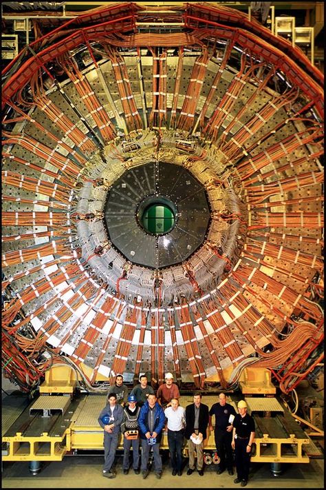 19 December 2000: DELPHI detector dismantling starts as LEP makes way for its successor, the LHC. This image shows DELPHI, one of the LEP detectors, being dismantled. With the end-caps removed, the inner parts of the DELPHI detector can be seen, including millions of wires needed to control the systems on the detector as readout data from the various components. DELPHI, which ran from 1989 to 2000 on the LEP accelerator, was primarily concerned with particle identification. Particle Collider, Tesla Technology, Hadron Collider, Particle Physics, Particle Accelerator, Large Hadron Collider, Nuclear Physics, Quantum Computing, Nicolas Tesla