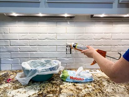 The Ultimate DIY Faux Brick Backsplash Tutorial & VideoWant the best faux brick for a backsplash? PVC panels for walls are low-cost, easy-to-cut, super durable & go over your old tile!You don’t have to spend a lot to have a beautiful kitchen! After painting kitchen cabinets, I realized my old backsplash looked outdated. Fortunately, I found the perfect solution that matched the fresh new look of my cabinets and required no demo! It’s hard to believe there’s a low-cost backsplash opti… White Brick Backsplash Kitchen, Painted Faux Brick Wall, Whitewash Brick Backsplash, Painted Brick Backsplash, White Brick Backsplash, Brick Ceramic Tile, Faux Brick Backsplash, Panels For Walls, Faux Brick Wall Panels