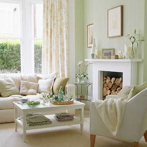 Pastel-living-room-with-antique-white-furnitures-fireplace-carpet-and-decorations Modern Living Room Colors, Country Living Room Design, Pastel Living Room, Furnitur Ruang Keluarga, Green Living Room, Spring Living Room, Cottage Shabby Chic, White Fireplace, Large Window