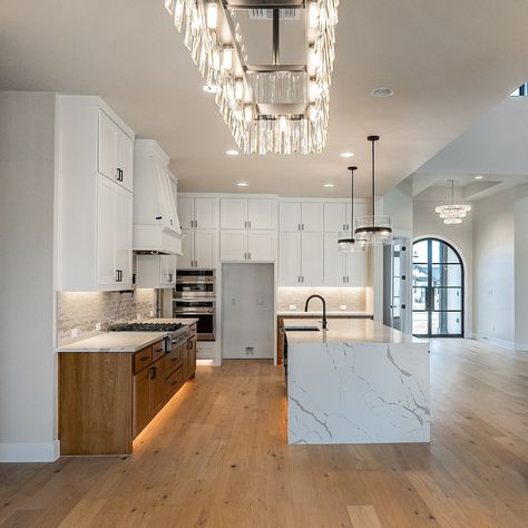 Stunning details in the kitchen opening up to high ceilings in the family room of this new Georgetown home. Kitchen Opening, Kitchen With High Ceilings, Dining Room Ceiling, Kitchen Ceiling, High Ceilings, High Ceiling, Open Up, Great Rooms, Kitchen Ideas