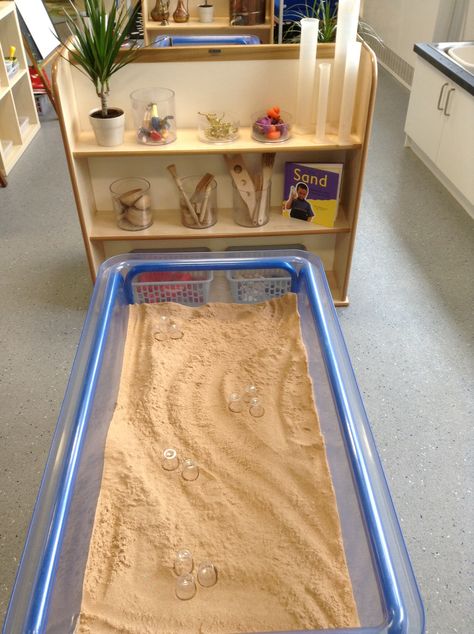 Sand area, using plastic shot glasses for miniature sandcastle building. Sand Eyfs, Sand Area Eyfs, Indoor Sand Area Eyfs, Sand And Water Area Eyfs, School Outdoor Area, Sensory Tubs, Reggio Classroom, Eyfs Classroom, Sand Play