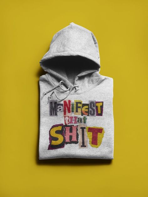 Classic white hoodie with the feminist slogan "Manifest that shit" on it made out of magazine cutout letters. Feminist Slogan, Letter Hoodie, White Hoodie, Classic White, Making Out, Pullover Hoodie, Sweatshirts