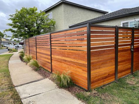 Image outdoor | Mahogany fence with iron frame #fencing #woodfence #mhagoniwood #gateinstallation #fenceinstallation | Instagram Fence Wood And Metal, Wood And Metal Fence, Firepit Seating, Seating Wall, Boundary Wall, Fire Pit Seating, Boundary Walls, Wall Seating, Aluminum Fence