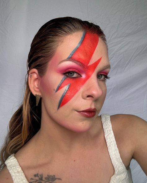 @davidbowie ⚡️ the first of my album icon looks for halloween!! i’m not the spookiest of gals but i do love to get creative for the season! this year i’ve collected some eye catching album covers and have done my glammy/makeup artist take on them 🎨 Aladdin Sane - David Bowie / an album cover I feel like most people have seen at least once in their life! This iconic lightning bolt look was designed originally in the 70s by Pierre Laroche (and inspired by a rice cooker would you believe) Ins... Elton John Makeup, David Bowie Makeup, Aladdin Sane, Elton John, Lightning Bolt, Rice Cooker, David Bowie, Aladdin, Halloween Ideas