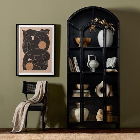 Display books, barware and other treasures in an arched cabinet with a glass pane detailed door. Solid iron is finished in soft, matte black with contrasting brass hardware.  Assembly Required? No Black Glass Cabinet, Arched Cabinet, Bookcase With Glass Doors, Display Books, China Cabinet Display, Glass Cabinets Display, Cabinet Black, Metal Arch, Cabinet Style