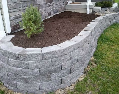 Blends earth tones with a weathered natural stone texture to bring a classic charm to any landscape. Lowe's 4-in H x 11.7-in L x 7-in D Grey/Charcoal Concrete Retaining Wall Block in Gray | 17H060GCH Diy Retaining Wall Cheap, Front Yard Retaining Wall, Cheap Retaining Wall, Retaining Wall Bricks, Backyard Hardscape, Concrete Block Retaining Wall, Block Retaining Wall, Natural Stone Retaining Wall, Small Retaining Wall