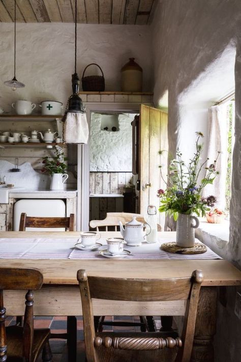 love this modern rustic country farmhouse kitchen dining room with reclaimed wooden cupboards, rustic wooden table, open shelves, rustic white-washed walls and tiled floor. Click through for more modern rustic farmhouse interiors ideas you'll love Modern Rustic Farmhouse Kitchen, Rustic Farmhouse Interior, Koti Diy, Wood Table Diy, Wooden Cupboard, Rustic Wooden Table, Modern Rustic Decor, Cottage Interior, Rustic Farmhouse Kitchen