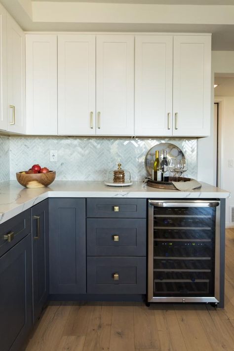 As seen on HGTV's Christina on the Coast, this kitchen features white upper cabinets and blue lower cabinets. Dark Blue Lower Kitchen Cabinets, White Upper Cabinets Grey Lower, Christina On The Coast Kitchen, Blue Lower Cabinets White Upper, White Upper Cabinets Dark Lower, Blue Lower Kitchen Cabinets, Blue Lower Cabinets, Christina On The Coast, Replacement Kitchen Cabinet Doors