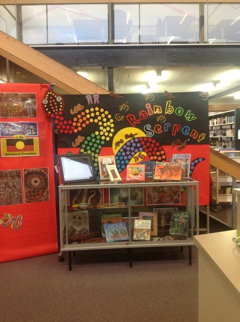 Our gorgeous Rainbow Serpent and Dreamtime display by our wonderful Library Technician Alana! Aboriginal Classroom Display, Aboriginal Wall Display Childcare, The Rainbow Serpent Activities, Naidoc Week Display Ideas, Nadoc Craft, Library Technician, Naidoc Week Activities, Reconciliation Week, Rainbow Display