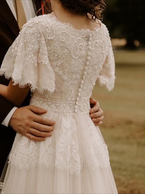 Light champagne Ivory lace dress with butterfly sleeve and boat neckline.

#modestweddingdress #myamazingweddingdress #custommademodestgown #custombridalgown Modest Lace Wedding Dresses, Edwardian Wedding, Modest Wedding Dress, St George Utah, Ivory Lace Dress, Pretty Wedding Dresses, Butterfly Sleeve, Modest Wedding, Sleeve Wedding Dress