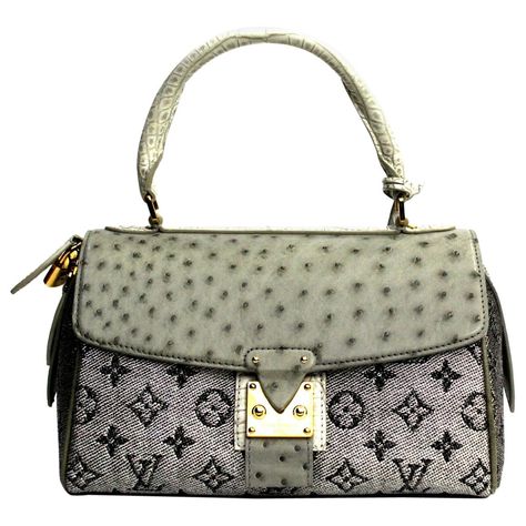 This LOUIS VUITTON Carrousel is in Excellent Pre-Owned Condition accompanied by Louis Vuitton Dust Bag, Lock, Keys, Clochette, Care Booklet, Tag, Bag Shaper. Circa 2010. Primarily made from Alligator Leather, Ostrich Leather, Jacquard Fabric complimented by Golden Brass hardware. Rare Designer Bags, Louis Vuitton Vintage Bag, Tas Louis Vuitton, Celebrity Bags, Louis Vuitton Dust Bag, Purse Collection, Bag Lock, Best Designer Bags, Limited Edition Bag