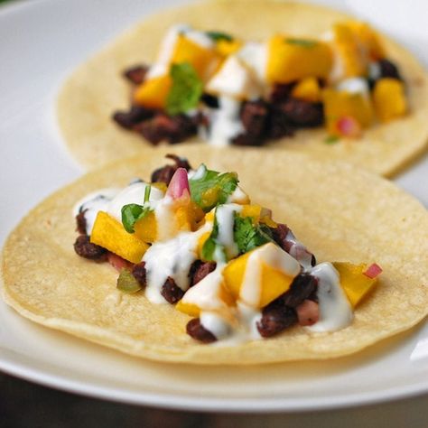 These simple, easy, and fresh mango black bean tacos have a deliciously creamy coconut sauce drizzled over the top. So yummy! | pinchofyum.com Mango Tacos, Chicken Tips, Pinch Of Yum, Black Bean Tacos, Bean Tacos, Coconut Sauce, Cooking Guide, Black Bean, Couscous