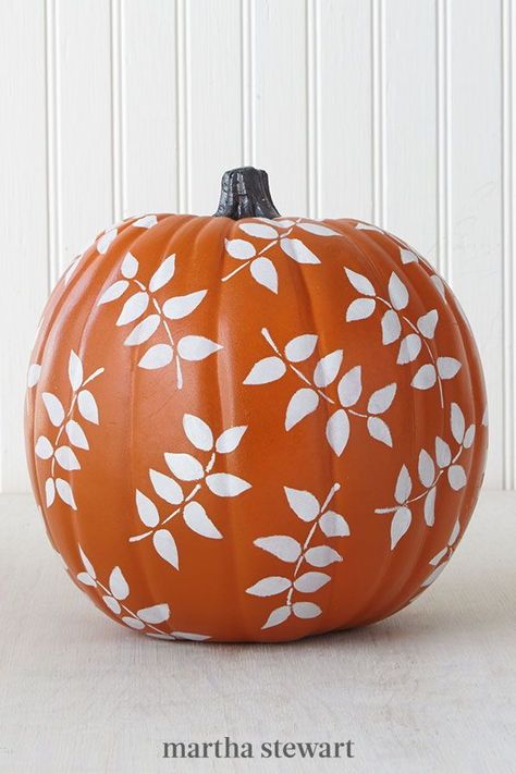 Autumn-inspired silhouettes add simple charm. To paint this pumpkin, adhere the leaf stencil to the pumpkin and pounce the inside of the stencil with white craft paint. Slowly, peel off the stencil and re-adhere it to a new spot on the pumpkin. Repeat this method until the pumpkin's entire rounded surface is covered in leaves. #marthastewart #pumpkins #diypumpkins #falldecor #halloween Ways To Paint A Pumpkin, Halloween Pumpkin Ideas, Paint A Pumpkin, Painted Pumpkin Ideas, Pumpkin Decorating Ideas, No Carve Pumpkin Decorating, Painted Pumpkin, Fall Inspiration, Pumpkin Ideas