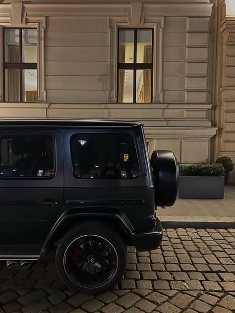 A black mercedes g wagon in front of the Ritz-Carlton in Vienna Austria G Wagon Interior Aesthetic, Black G Wagon Aesthetic, Aesthetic G Wagon, G Wagon Black, G Wagon Aesthetic, Wien Aesthetic, World Expensive Car, Expensive Aesthetic, Black G Wagon