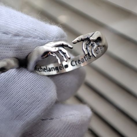 it made of Sterling Silver 925 k. The Creation of Adam Sterling Silver Ring discounted for a short time promotion. Ring inspired by Michelangelo's Creation of Adam in the Sistine Chapel, promotin ring, on sale ring, campain ring, discounted ring. 925 Silver Rings Men, Cool Rings Aesthetic, Guy Rings, Greek Rings, David Tattoo, David Ring, The Sistine Chapel, Bling Ideas, The Creation Of Adam