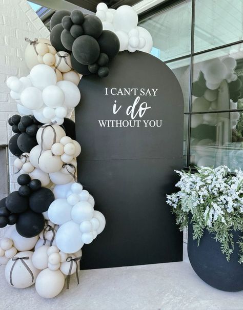 #birthdaydecoration #birthdayparty #eventplanner  #balloondecor #tabledecor #firstbirthday #partyideas Black And White Theme Engagement Party, Black And White Wedding Balloons, Black Bow Engagement Party, Black Photo Backdrop Ideas, Black White Balloon Decorations, Black Balloon Garland Backdrop, Black White Gold Engagement Party, Black And White Brunch Decor, Black And White Balloon Backdrop