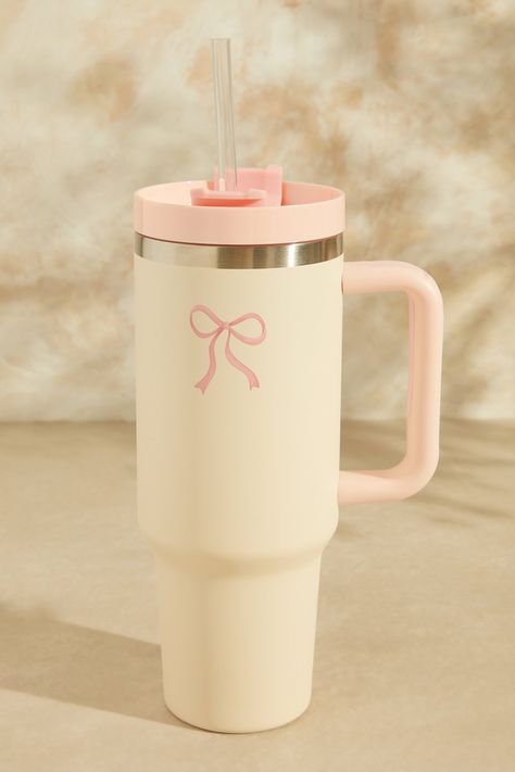 Bow Kait Cup in Light Pink | Altar'd State | Altar'd State Stanley Cup Aesthetic Decorated, Cute Cup Designs Ideas, Aesthetic Bottle, Aesthetic Cups, Cute Bottle, Parfum Victoria's Secret, Coconut Bowls, Trendy Water Bottles, Stanley Cups