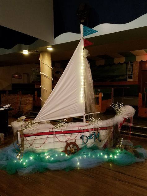 Cardboard boat prop for a wedding Diy Boat Prop, Vbs Boat Prop, Cardboard Sailboat, Cardboard Boat Diy, Cardboard Waves, Boat Props, Kids Church Decor, Cardboard Props, Vacation Bible School Craft