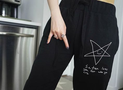 gothic pentagram fashion clothing, satan loves you long clothing joggers, goth satanic pentagram sweatpants,  satan pentagram star pentacle lounge pants, gothic loungewear, goth lounge, lounging home wear Goth lounge clothes. casual Goth fashion, boy london, dollskill dolls kill joggers sweatpants. More at https://www.lacarmina.com/blog/2020/05/gothic-loungewear-satan-sweatpants-new-york-vessel-hudson-yards/ Goth loungewear: Satan loves you for you are  pentagram sweatpants by Long Clothing! Goth Lounge Wear, Casual Goth Fashion, Goth Joggers, Goth Lounge, Goth Loungewear, Goth Satanic, Satanic Pentagram, Goth Travel, Loves You