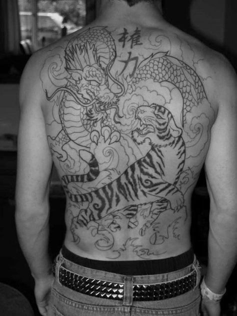 Unique Mens Tiger Dragon Tattoos Dragon Tiger Back Tattoo, Tiger Back Tattoo Men, Dragon And Tiger Back Tattoo, Tiger And Dragon Tattoo Japanese Style, Tatoos Men Back, Dragon Back Tattoos Men, Back Tattoo Tiger, Best Back Tattoos Men, Men’s Back Tattoo