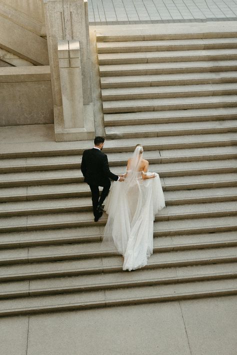 bride and groom walking up grand steps on their wedding day Stairs Wedding Photos, Wedding Photos Staircase, Bride On Stairs, Wedding Stairs, Walking Up Stairs, Photo Bridge, The In Between, Groom Poses, Groom Portraits