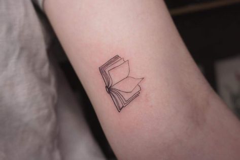 Minimalist book piece by Alison Book Tattoo For Men, Book Tattoo Dainty, Stack Of Books Tattoo Simple, Simplistic Book Tattoo, Book Tattoo Men, Book And Flowers Tattoo, Tattoo Book Ideas, Mini Book Tattoos, Book Tattoo Ideas For Men