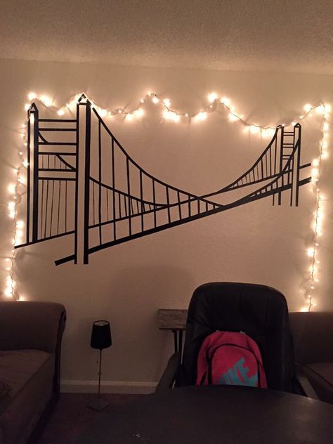 I had this huge wall in my apartment and wanted to do something with it so I used electric tape and did this wonderful master piece of the Golden Gate Bridge❤️ By the way this was don't free hand, using no stencil. Washi Tape Ideas Wall Apartments, Tape Mural Wall Art, Electrical Tape Wall Art, Tape Painting Wall, Tape Art Wall, Tape Art Ideas, Washi Tape Wall Decor, Washi Tape Wall Art, Washi Tape Wall