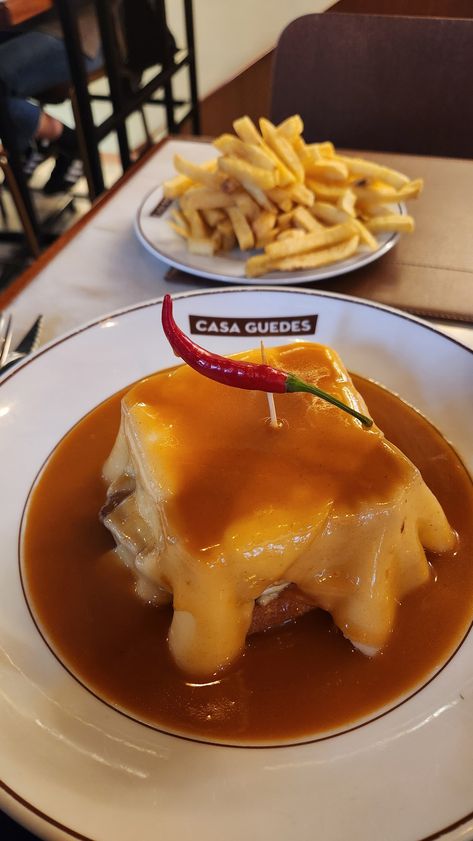 Casa guedes, Portugal, portuguese, portuguese food, portuguese sandwich, cheese, food, foodies, food recipes, Francesinha, pork, cheese, gravy, what to eat in Portugal, Portugal 🇵🇹 Portuguese Sandwich, Cheese Gravy, Sandwich Cheese, Cheese Food, Portuguese Food, Portuguese Recipes, Portugal Travel, What To Eat, Travel Inspo