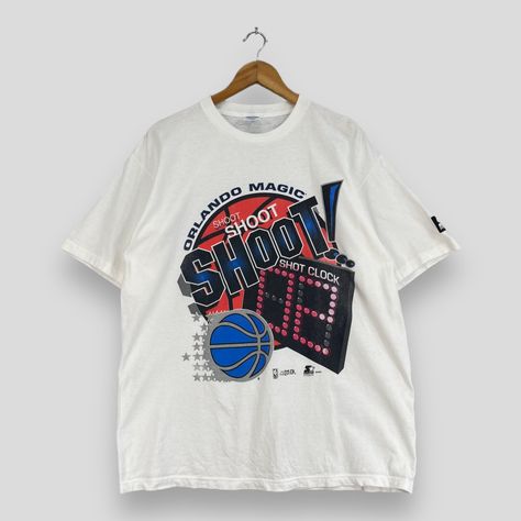 Vintage 90's ORLANDO MAGIC Nba Tshirt Medium Starter America Basketball Team Sportswear Orlando Magic Shoot Clock White Tees Size M *All measurements are taken with the garment flat on the ground. SIZE ON TAG :- Size L but fits like Size M ACTUAL SIZE MEASUREMENT :- ARM PIT TO ARM PIT :- 22.5" inches BACK COLLAR TO HEM :- 29.5" inches CONDITION :- GREAT USED CONDITION. NO HOLES AND STAINS. REF : (12-01-2020) 151 Vintage Nba Shirt, Vintage Basketball Tee, Basketball Fan Shirts, Chuck Taylor Black, Cold Weather Jackets, Basketball Sweatshirts, Nba T Shirts, Basketball Tees, Denim Workwear