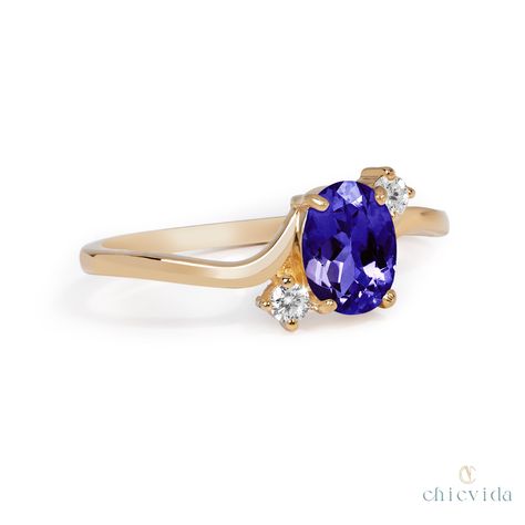 DetailsMaterial: 14k/18k goldColor Options: Yellow Gold, White Gold, Rose Gold★ Center StoneTanzanite, OvalSize: 5x7 mmApprox Weight (Ct): 0.80★ Accent StonesDiamond RoundSize: 1.5 mm * 16 Nos.Approx Weight (Ct): 0.224★ Band Width: 1.3 mm Wedding Anniversary Ring, Wedding Anniversary Rings, Natural Gemstone Jewelry, Tanzanite Ring, Blue Tanzanite, 18k Gold Ring, Engraved Items, Anniversary Ring, Engagement Wedding