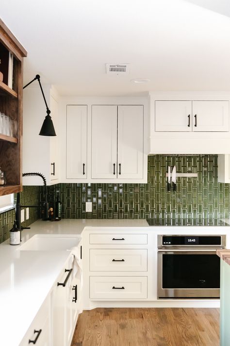 This modern farmhouse kitchen at our Summer Lane project was transformed by this high-gloss green subway tile. The pop of color in the backsplash is such a beautiful contrast to the white cabinets, warm wood open shelving, and black cabinet hardware! Wood Open Shelving, Green Kitchen Backsplash, Green Tile Backsplash, Green Subway Tile, Calm Nature, Green Backsplash, Black Cabinet Hardware, Sleek Kitchen, Kitchen Tile