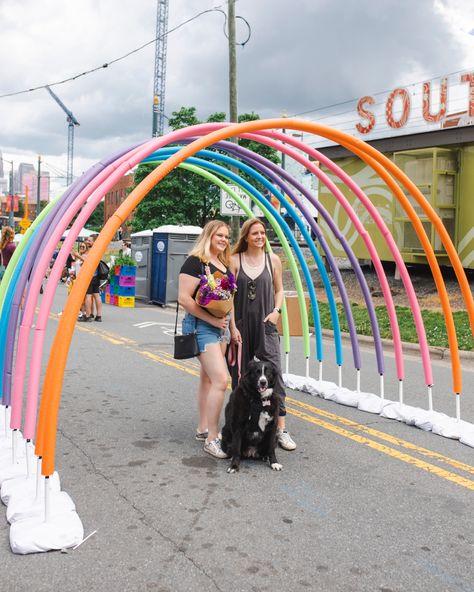 Row of pool noodle arches to look like a rainbow Pride Art Installation, Photo Op Ideas Events, Pride Event Decor, Pool Noodle Backdrop, Festival Event Ideas, Pride Event Ideas, Pool Noodle Arch, Pride Installation, Event Activation Ideas