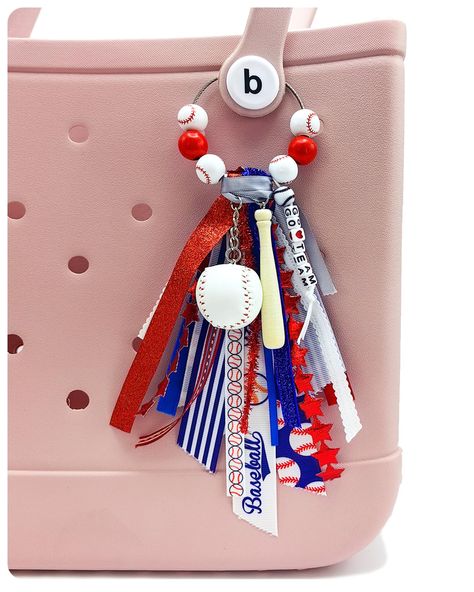 PRICES MAY VARY. ⚾ Elevate Your Style with Sporty Glamour: Our Bogg Bag accessory combines a trendy tassel crafted from different ribbons, a soccer charm, and eye-catching wooden beads. This handmade bogg bag charm instantly adds a touch of sporty glamour to any bag, making heads turn wherever you go. 💯 Premium Quality Craftsmanship: Our handmade Bogg Bag Charm is meticulously crafted using high-quality materials and detailed workmanship. From the intricately designed tassel to the durable base Cheer Bag Keychains, How To Make Bogg Bag Tassels, Bogg Bag Charms, Bogg Bag Accessories, Team Mom Baseball, Tote Bag Accessories, Team Crafts, Baseball Accessories, Football Diy