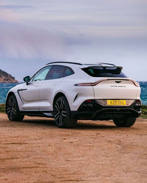 The Aston Martin DBX707 SUV features a 4.0-litre V8 engine which can generate 697 hp of peak power and 900 Nm torque. In order to make the engine deliver the maddening numbers, Aston Martin has fitted a new pair of turbochargers to the SUV alongside calibrating the engine that ensures the additional boost. Aston Martin DBX707 comes with a nine-speed wet-clutch gearbox that gets both automatic and manual modes. The BDX707 SUV is priced at $232,000 Ashton Martin Suv, Aston Martin Truck, Aston Martin Dbx 707 Wallpaper, Austin Martin Suv, Dbx Aston Martin, Aston Martin Dbx Suv, Suv Aesthetic, Aston Martin Dbx 707, Aston Martin Suv