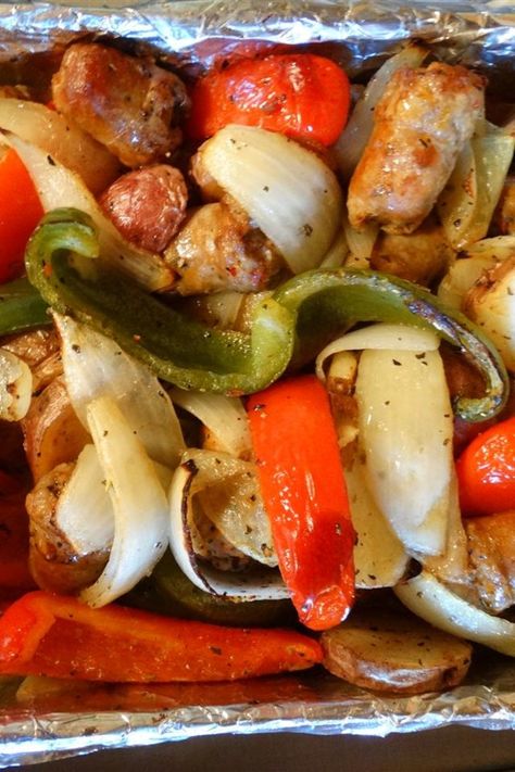 Sausage, Peppers, Onions, and Potato Bake | "This is an Italian comfort food classic! The smell of this cooking in my kitchen transports me back to playing on the street in front of my Papa and Gigi's house in Brooklyn. I make 2 trays of this for every family get-together, and it's gone in a flash!" #allrecipes #worldcuisine #internationalrecipes #globalrecipes #regionalrecipes #globalfoods #internationalfoods Sausage Pepper Onions And Potatoes, Sausage Peppers Onions, Sausage Peppers And Onions, Sausage Peppers, Italian Comfort Food, Italian Sausage Recipes, Sausage Dishes, Potato Bake, Tandoori Masala