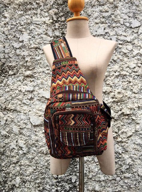 "♥ SLING SMALL BACKPACK BOHEMIAN BOHO LIGHTWEIGHT CHEST SHOULDER CROSSBODY DAYPACK BAG HANDMADE & FASHIONABLE - Handmade with local Nepalese Artisan with unique Aztec tribal bohemian patterns. DURABLE - Made from sustainable organic cotton which are not just durable but good for environment as well. Construction Exterior and Straps: Tribal woven fabric, Canvas Closure: Zipper Outside Pockets : 1 zipper pocket, a front pocket with Velcro flap closure, mini side pocket Inside Pocket: 1 zipped pock Boho Backpack, Bohemian Pattern, Boho Purses, Fabric Animals, Boho Bag, Hippie Bohemian, Fabric Bag, Woven Bag, Men's Backpack