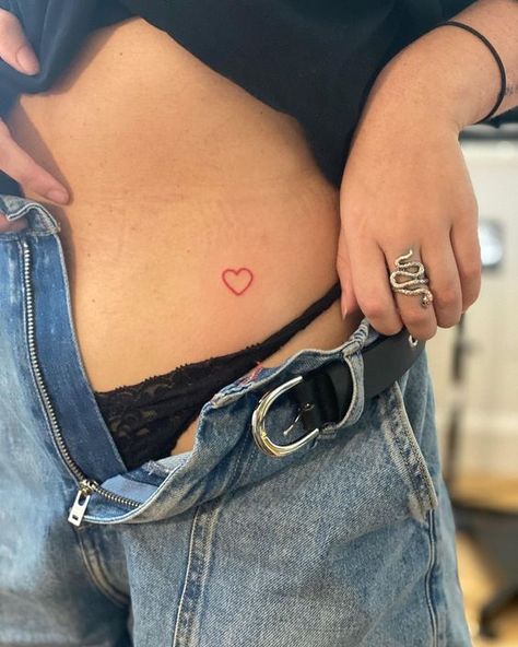 Heart Hip Tattoos Women, Red Outline Heart Tattoo, Red Heart Hip Tattoo, Red Heart Tattoo On Hip, Heart Tattoo Stomach, Heart On Hip Tattoo, Red Ink Heart Tattoo, Heart Hip Tattoo, Heart Line Tattoo