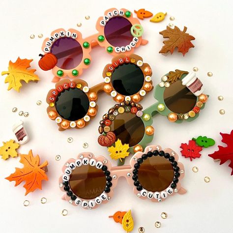 "The cutest Fall Style Sunglasses for kids  These are Absolutely adorable! Each pair is designed & handmade by me; Using various beads, Rhinestones, and charms.  So much fun for so many occasions... whether it's photoshoots, parties, pumpkin patches, Birthdays, or just for fun! These also make the BEST GIFTS!! 😊 HOW TO ORDER: *Choose your style-- STYLES AVAILABLE: 1. PUMPKIN SPICE CUTIE  2. SPICE GIRL 3. ITS FALL YALL 4. PUMPKIN PATCH CUTIE * Anti-Glare * UV Protection (UVA & UVB) * Durable and shatterproof * They open and close smoothly *Each item is made to order and will be ready to ship in 5-7 business days! If you need your order sooner. Please check out my \"RUSH ORDER OPTION\". https://www.etsy.com/EyeCandyandFluff/listing/1286351273/rush-my-order-please *SHOP DISCLAIMER/WAIVER if Diy Kids Sunglasses, Diy Sunnies, Fall Craft Kids, Christmas Shoes Diy, Fair Crafts, Weaving Beads, Fall Craft Fairs, Diy Sunglasses, Girls Sunglasses