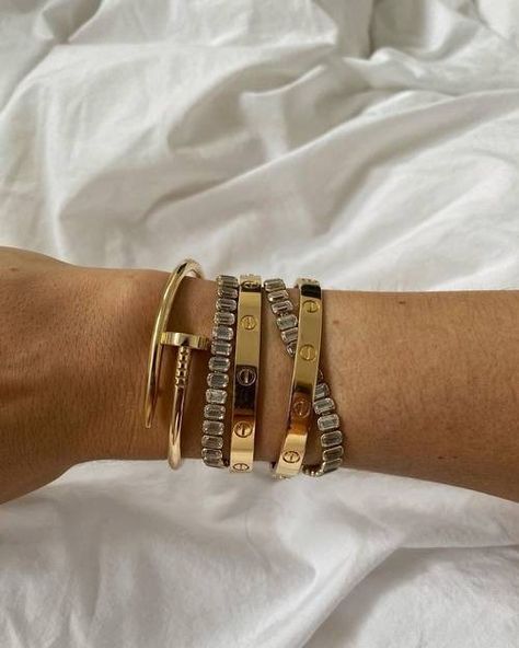 How Cartier's Juste un Clou Bangle Became a Cult Buy | Who What Wear UK Cartier Juste Un Clou Ring Stack, Cartier Juste Un Clou Bracelet Diamonds, Cartier Gold Jubilee Bangle Bracelet, Just En Clou Bracelet, Cartier Clash Bracelet, Just Un Clou Bracelet Cartier, Juste Un Clou Bracelet, Cartier Juste Un Clou, Status Symbol