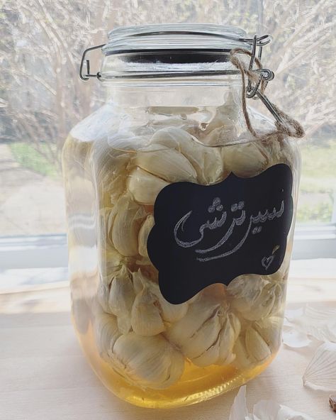 Seer Torshi - Pickled garlic in apple cider vinegar with grape molasses and salt #سیر_ترشی Now, let’s see if I can wait for 7 years! 😋… I Can Wait, Saffron Recipes, Iranian Cuisine, Pickled Garlic, Persian Food, Molasses, Cider Vinegar, Mason Jar Mug, Apple Cider Vinegar